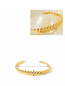 Detailed view of 18K gold plated C-shaped cuff bracelet with twisted rope texture details