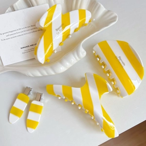 French acetate hair claw set with yellow and white stripes for retro ponytail styling
