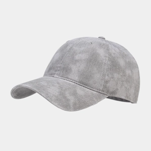 Detailed close-up of light gray washed canvas texture on a classic six-panel baseball cap