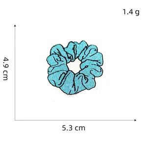 Detail of blue flower embroidery patch showing 5.3x4.9cm dimensions and 1.4g weight