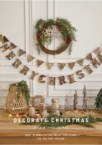 Close-up of rustic wood Merry Christmas sign with pine needles and festive holiday ornaments
