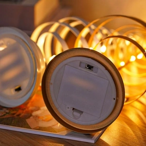 Detail view of the battery compartment and power switch on the Christmas tree lamp base