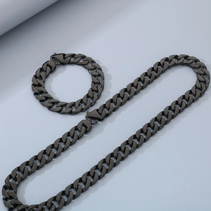 Close-up of 15mm beveled curb chain necklace and bracelet set with lobster clasps