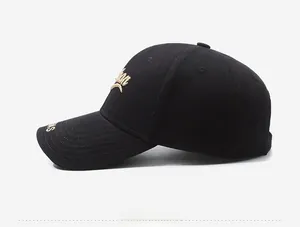 Side view of structured black baseball cap with premium golden embroidery on canvas