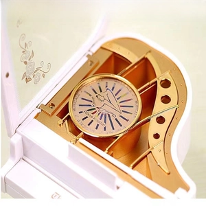 White piano music box with rotating ballerina and golden mechanical movement