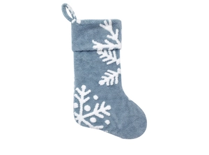 Close-up of Morandi blue plush Christmas stocking with white jacquard snowflake patterns