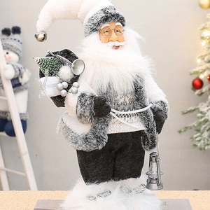 Standing Santa Claus figurine in grey knit sweater with vintage lantern and gift bag
