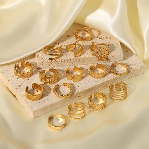 Set of 14 minimalist 18k gold plated stainless steel rings with floral and leaf designs