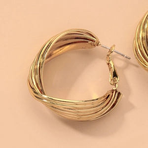 Macro shot of 18K gold-plated twisted layered geometric hoop earrings for women