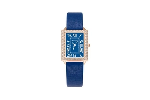 Detailed macro of a rectangular rose gold watch with blue leather strap and crystal bezel