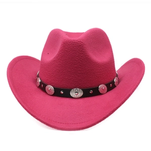 Detailed view of magenta felt cowboy hat with vintage silver studs on a black hatband