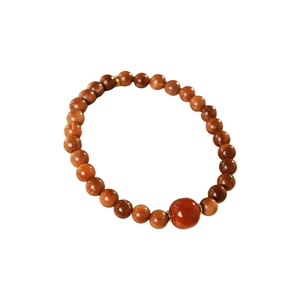Minimalist red agate beaded bracelet with vintage style and elegant golden spacers