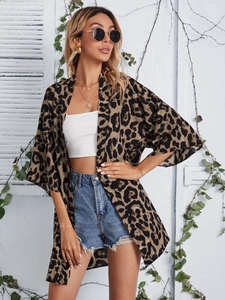 Detail of trendy leopard print cardigan featuring a lapel collar and stylish five-point sleeves
