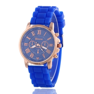 Blue silicone Geneva quartz watch with rose gold case and Roman numeral dial on white background