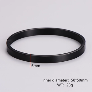 Detail view of 6mm black brushed metal bangle showing 58x50mm inner diameter dimensions