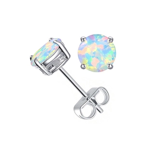 Macro view of 6mm iridescent opal stud earring with silver four-prong setting