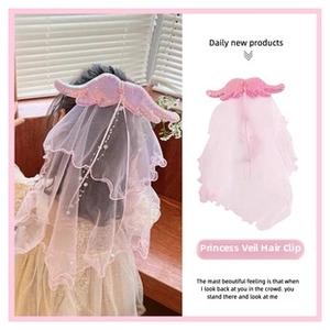 Detail of pink fairy wings hair clip with glitter mesh veil for kids princess style
