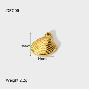 Macro detail of 14K gold plated scallop pendant with 15mm by 14mm size specifications