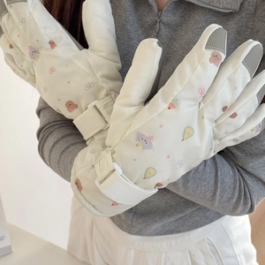 Close-up of cute cartoon pattern and adjustable velcro strap on thick ski gloves