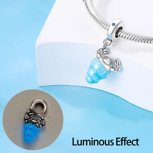 Luminous silver crab charm with blue enamel for DIY bracelets showing glow effect