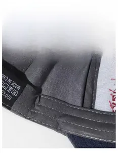 Detail of grey washed baseball cap interior showing black sweatband and 100% cotton wash label
