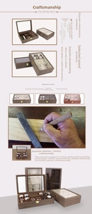 Wooden jewelry storage box with clear glass lid, multiple velvet compartments for watches.