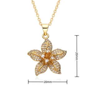 Macro detail of 20mm gold-plated lotus pendant with sparkling rhinestones and dimension markings