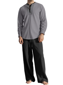 Detail of grey Henley neck shirt with vertical stripes and black linen wide-leg pants
