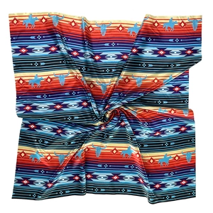 Western style silk scarf featuring cowboy patterns with vibrant ethnic geometric prints