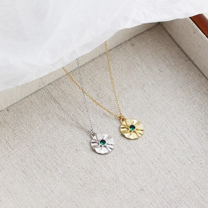 Retro S925 silver sunburst star necklace with emerald green stone in gold and silver