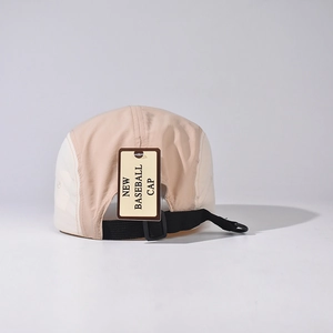 Detail view of khaki five-panel camping cap showing nylon strap and back buckle adjustability