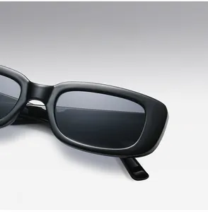 Detail view of black vintage rectangular sunglasses featuring a thick PC punk frame