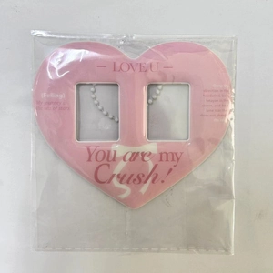 Pink heart-shaped dual card holder with ballet style pattern in transparent packaging