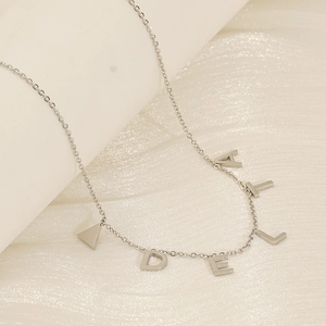 Silver stainless steel letter necklace with A, L, E, D and triangle charms on a fine chain