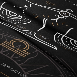Close-up of soft black velvet Libra zodiac tapestry with white 22nd October lettering