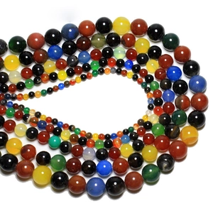 Macro display of colorful natural stone round beads for DIY jewelry making and crafts
