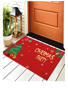 Détail du paillasson rouge de Noël avec lettrage doré et motifs de fête élégants