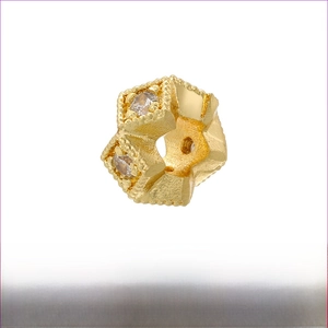 Detail of 18K gold-plated brass spacer bead with cubic zirconia for jewelry making