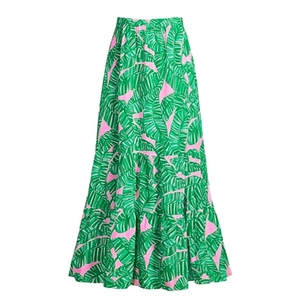 Detail of pink skirt with green banana leaf print and layered high-waist design