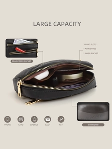 Macro detail of black leather crossbody bag interior with large capacity pockets