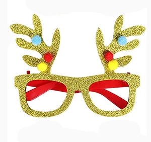 Detail of glitter gold reindeer antler party glasses with colorful pom-poms and red temples