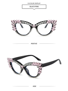 Detail view of cat eye glasses frame with pink and clear crystals on black rim