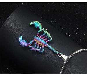 Macro shot of colorful stainless steel scorpion pendant with metallic luster and silver chain