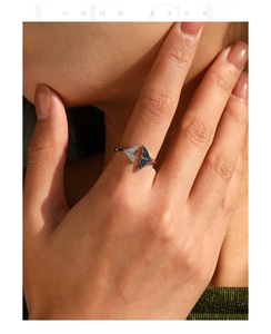 Detailed close-up of S925 sterling silver mermaid tail ring with blue and white crystals