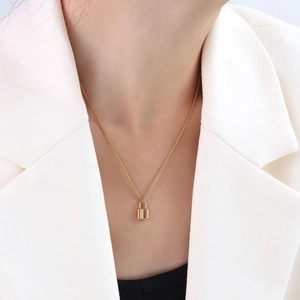 Minimalist 18k gold plated stainless steel padlock pendant necklace on female model
