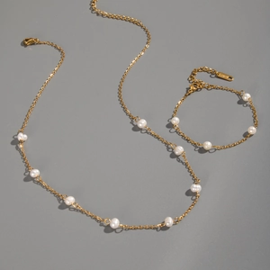 Detail of 18KGP gold plated necklace and bracelet set with freshwater pearls