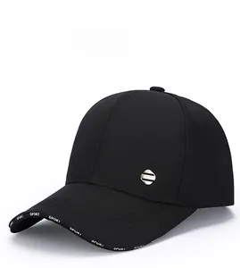 Detail of black baseball cap with side metal logo and SPORT printed on the brim