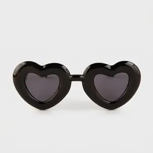 Fashionable heart-shaped sunglasses with thick black frames and dark grey lenses for women