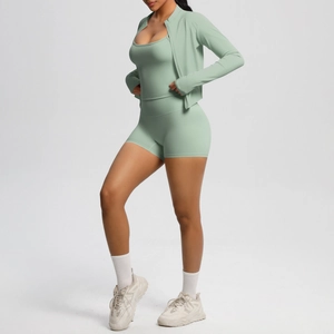 Three-piece yoga set including zip jacket, camisole, and shorts in mint green fabric