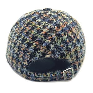 Rear view of houndstooth baseball cap showing fuzzy multi-color texture and metal buckle
